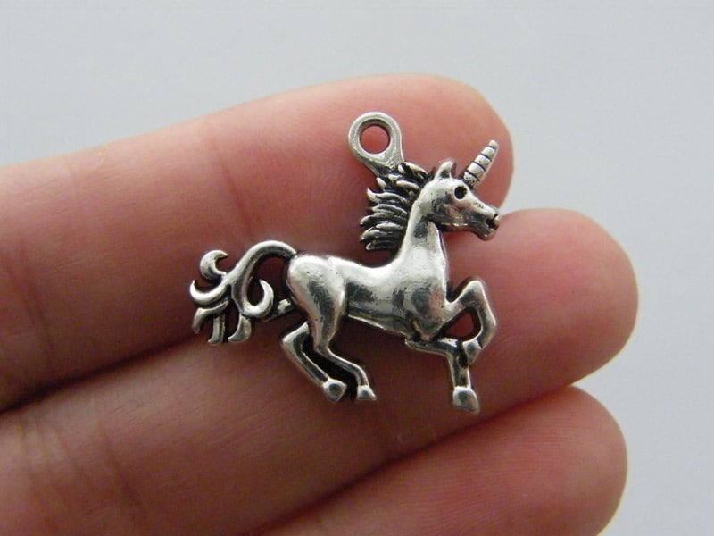 2 Unicorn charms antique silver tone A431