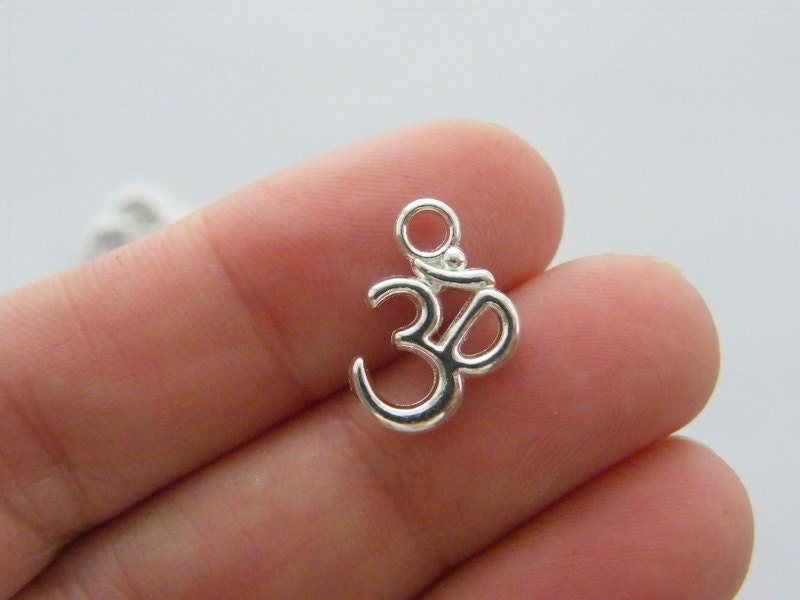 12 Om charms silver plated tone I87