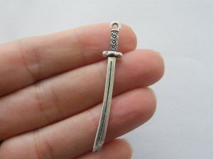 6 Sword pendants antique silver tone SW57