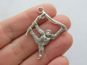 4 Orangutan pendants antique silver tone A133