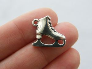 4 Ice skate charms antique silver tone SP51