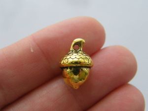 6 Acorn charms antique gold tone L83