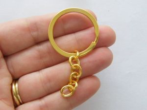 4 Key rings 66 x 32mm gold plated FS385