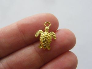 8 Turtle charms gold tone FF677