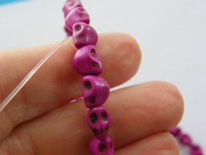 48 Purple medium orchid skull beads 8 x 6mm SK15