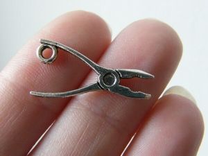12 Pair of pliers tool charms antique silver tone P593
