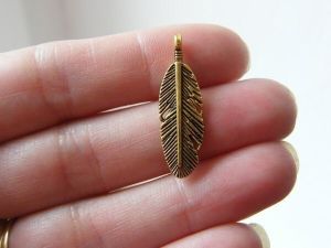 8 Feather  pendants antique gold tone B190