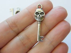 10 Skull key charms antique silver tone K23