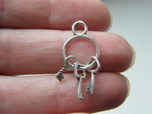 8 Key ring charms antique silver tone K11