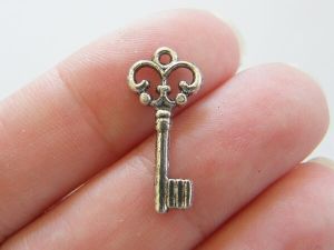 16 Key charms antique silver tone K4