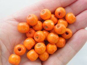 100 Orange dyed wood beads 10 x 9mm AB473 - SALE 50% OFF