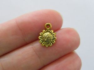 20 Sunflower charms antique gold tone F614