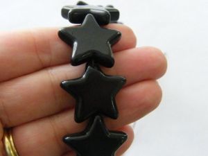 18 Star charm beads 25 x 26mm black  S4