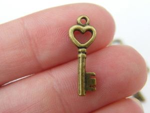10 Key charms antique bronze  tone K58