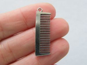 8 Comb charms antique silver tone P356