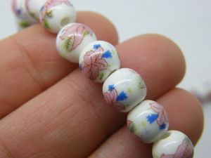 40 Flower beads  9 x 8mm white ceramic B232