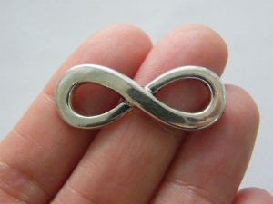 12 Infinity charms or connectors antique silver tone I49