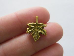 8 Maple leaf charms antique gold tone L221