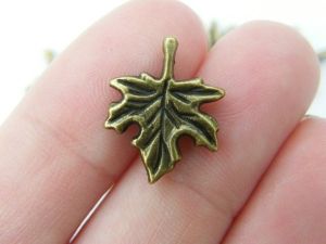 10 Maple leaf charms antique bronze tone L80