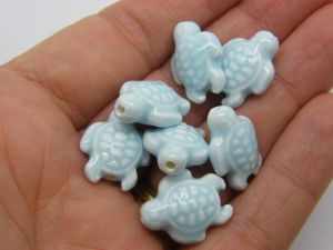8 Turtle beads light blue porcelain FF423