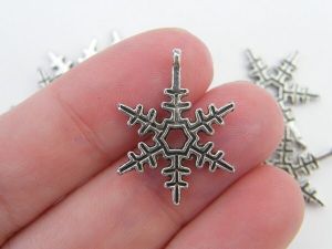 8  Snowflake charms antique silver tone SF8