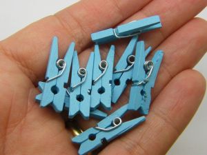 10 Small blue wooden pegs P754