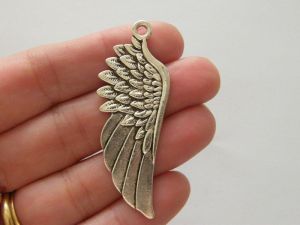 4 Angel wing pendants antique silver tone AW37