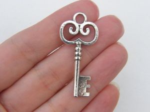 4 Key pendants antique silver tone K30