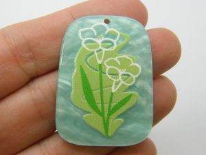 8 Beautiful white and green flower on a striking blue background pendants acrylic F265