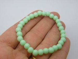 6 Green beaded bracelets elasticated
