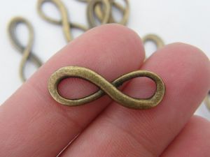 12 Infinity charms or connectors 23 x 8mm antique bronze tone I51
