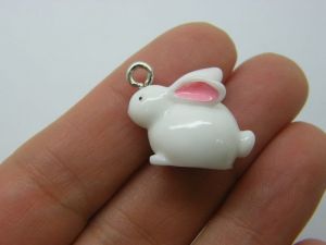 4 Rabbit pendants white pink resin A527