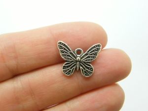 8 Butterfly charms antique silver tone A558