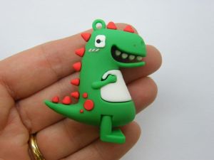 4 Dinosaur pendants green PVC plastic 02C