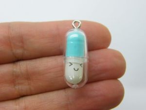 6 Face capsule in a capsule charms blue white clear plastic M143