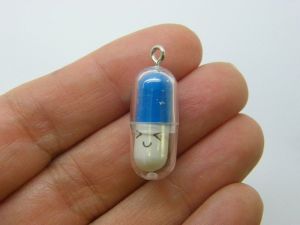 6 Face capsule in a capsule charms dark blue white clear plastic M366