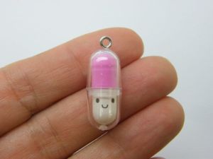 6 Face capsule in a capsule charms  deep pink white clear plastic M274
