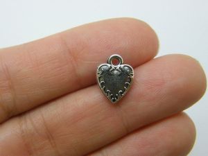 10 Heart flame charms antique silver tone H194