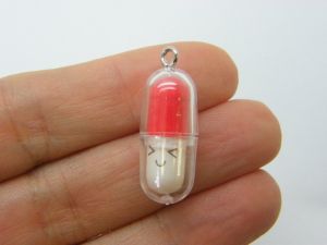 6 Face capsule in a capsule charms red white clear plastic M385