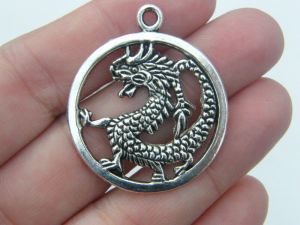 4 Dragon pendants antique silver tone A70