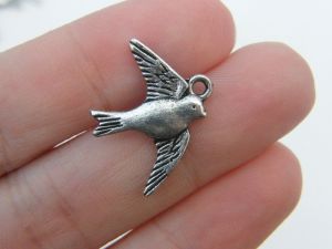 10 Bird swallow  charms antique silver tone B48