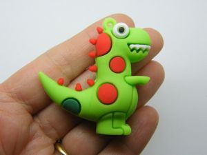 4 Dinosaur pendants green PVC plastic 06B
