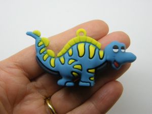 4 Dinosaur pendants blue PVC plastic 01D
