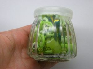 1 Glass bottle jar with plastic lid 6.85 x 6.8cm with random green beads