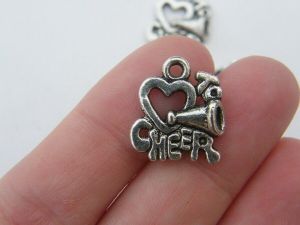 10 Love to cheer charms antique silver tone SP87