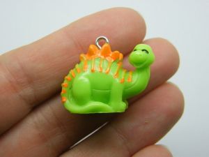 4 Dinosaur pendants green and orange resin A591