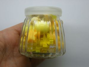1 Glass bottle jar with plastic lid 6.85 x 6.8cm with random yellow beads