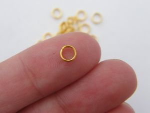 200 Split rings 5mm gold tone