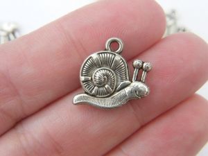 8 Snail charms tibetan silver A205