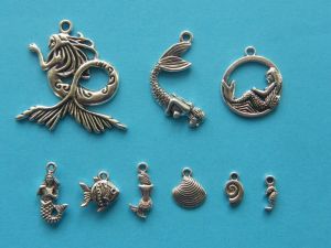 The Big Mermaid Collection - 9 different antique silver tone charms